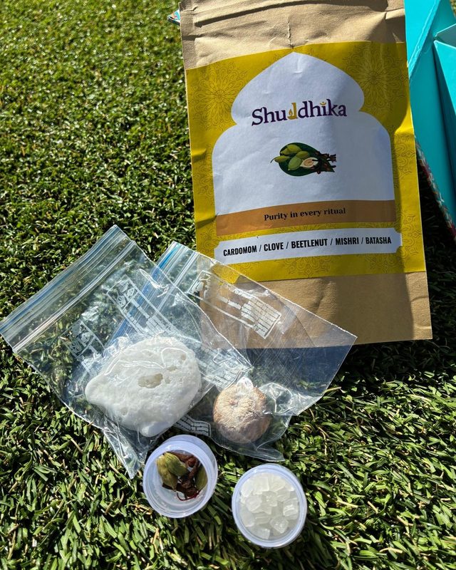Yellow Shuddhika pouch with cardamom, clove, betel nut, mishri and batasha