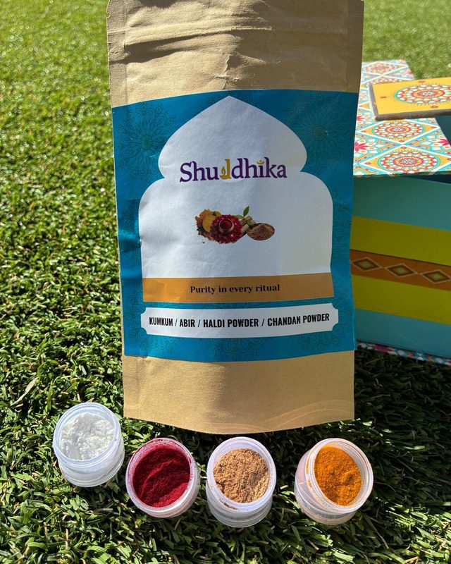 Blue Shuddhika pouch with jars of kumkum, abir, haldi and chandan powder