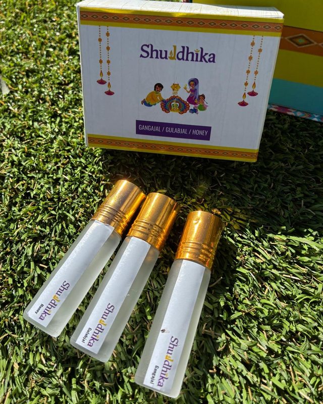 Three Shuddhika bottles of Gangajal, gulabjal and honey with their box