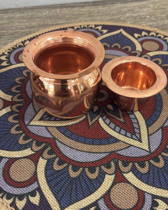 A copper kalash and a small copper bowl
