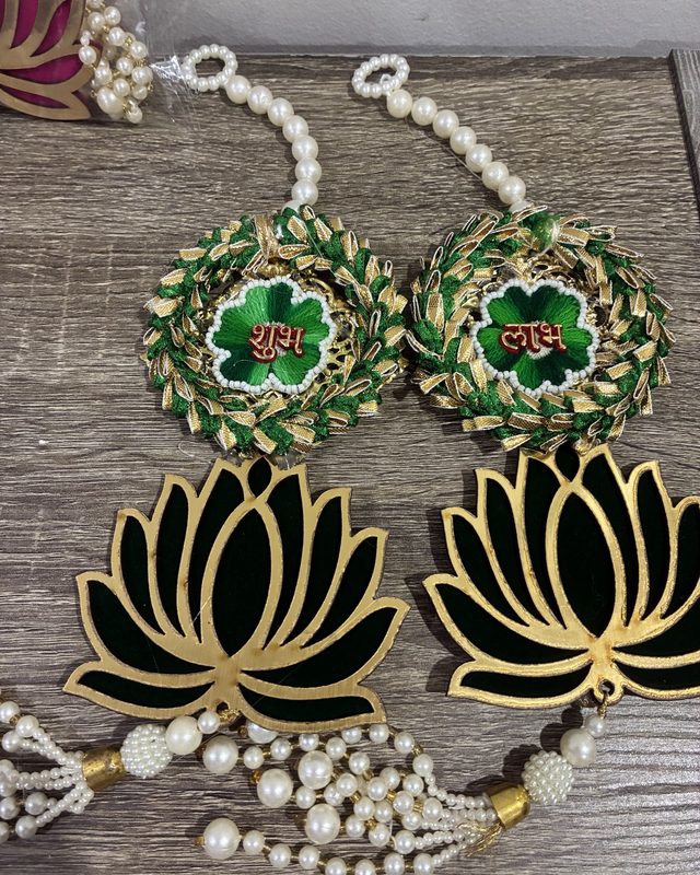 Shubh Labh door hangings with lotus motifs and pearl tassels