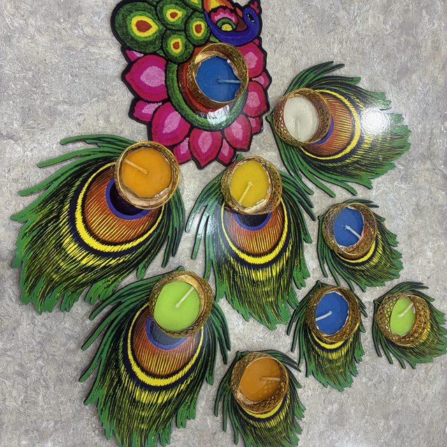 Tealight holders shaped like peacock feathers