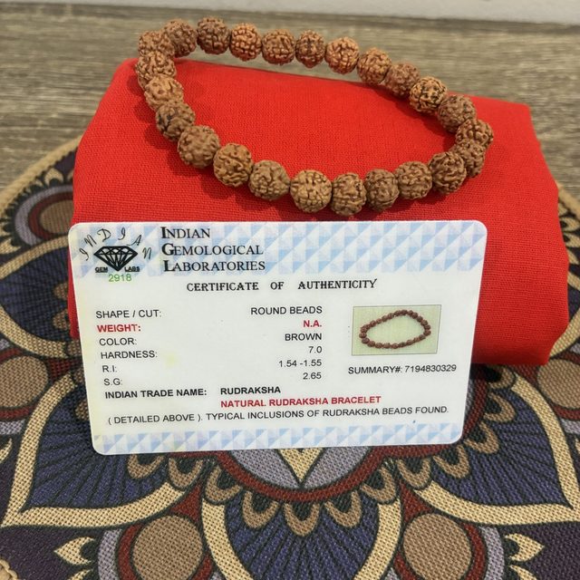 A rudraksha bracelet with its lab certificate